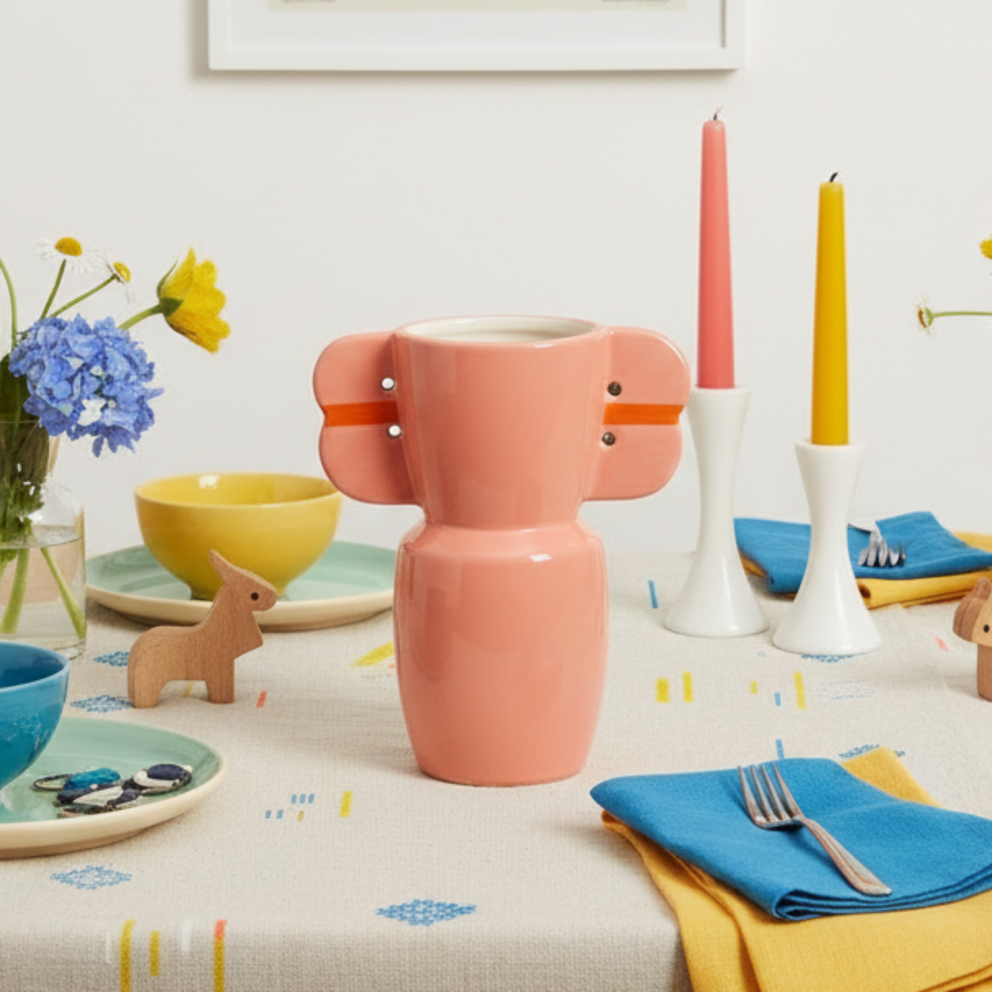 Pink vase with orange accents on a white background