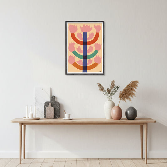 Colorful abstract art print on a gray wall above a kitchen counter.