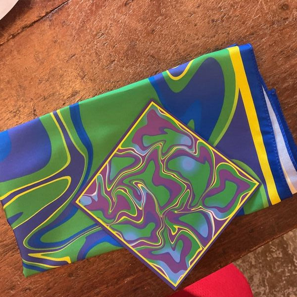 Colorful fabric with abstract design on a wooden surface