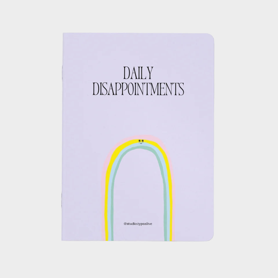 Notebook with a rainbow design and text on a white background
