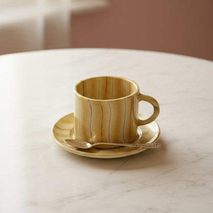 HANDMADE MARBLED CERAMIC CUP AND SAUCER IN YELLOW