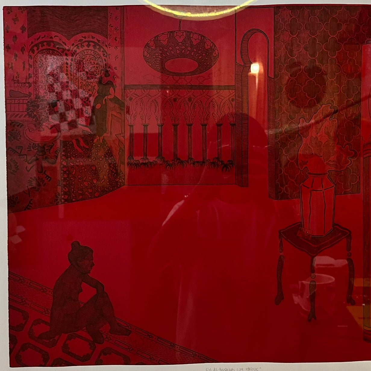 Framed artwork of a red room with silhouettes of people and furniture.