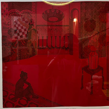 Framed artwork of a red room with silhouettes of people and furniture.