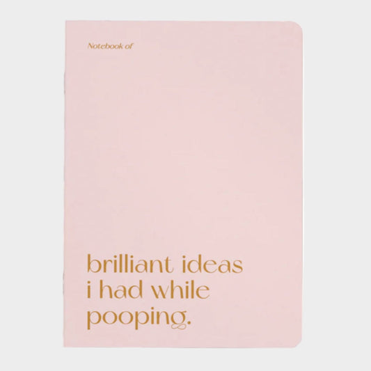 Pink notebook with gold text on a white background