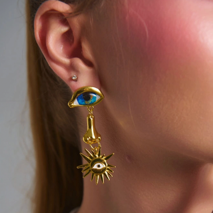 BLUE EYES AND PIERCED NOSE EARRINGS