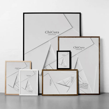 A collection of picture frames from the brand ChiCura, featuring a variety of sizes and a black frame in the background.