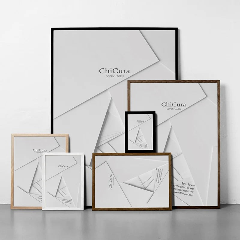 A collection of picture frames from the brand ChiCura, featuring a variety of sizes and a black frame in the background.