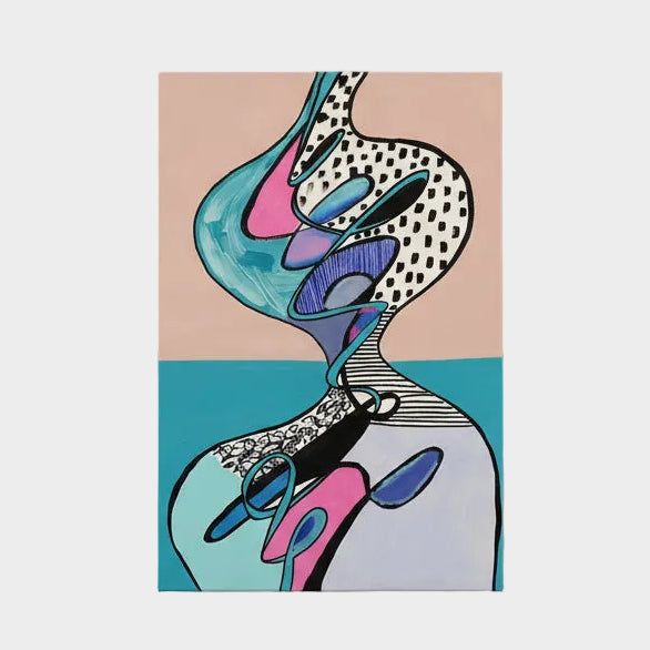 Abstract artwork on a table with a bookshelf in the background