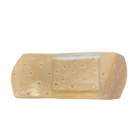 SHELF SITTER BAND-AID CERAMIC SCULPTURE