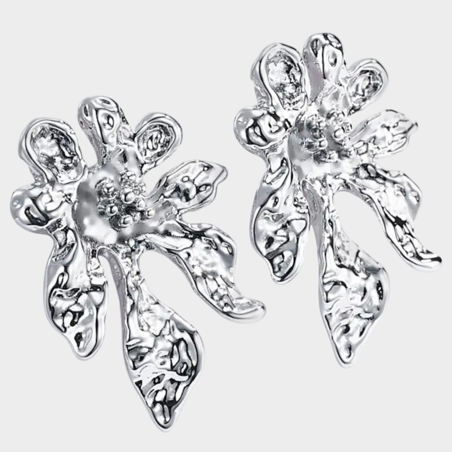 Silver fairy earrings on a white background