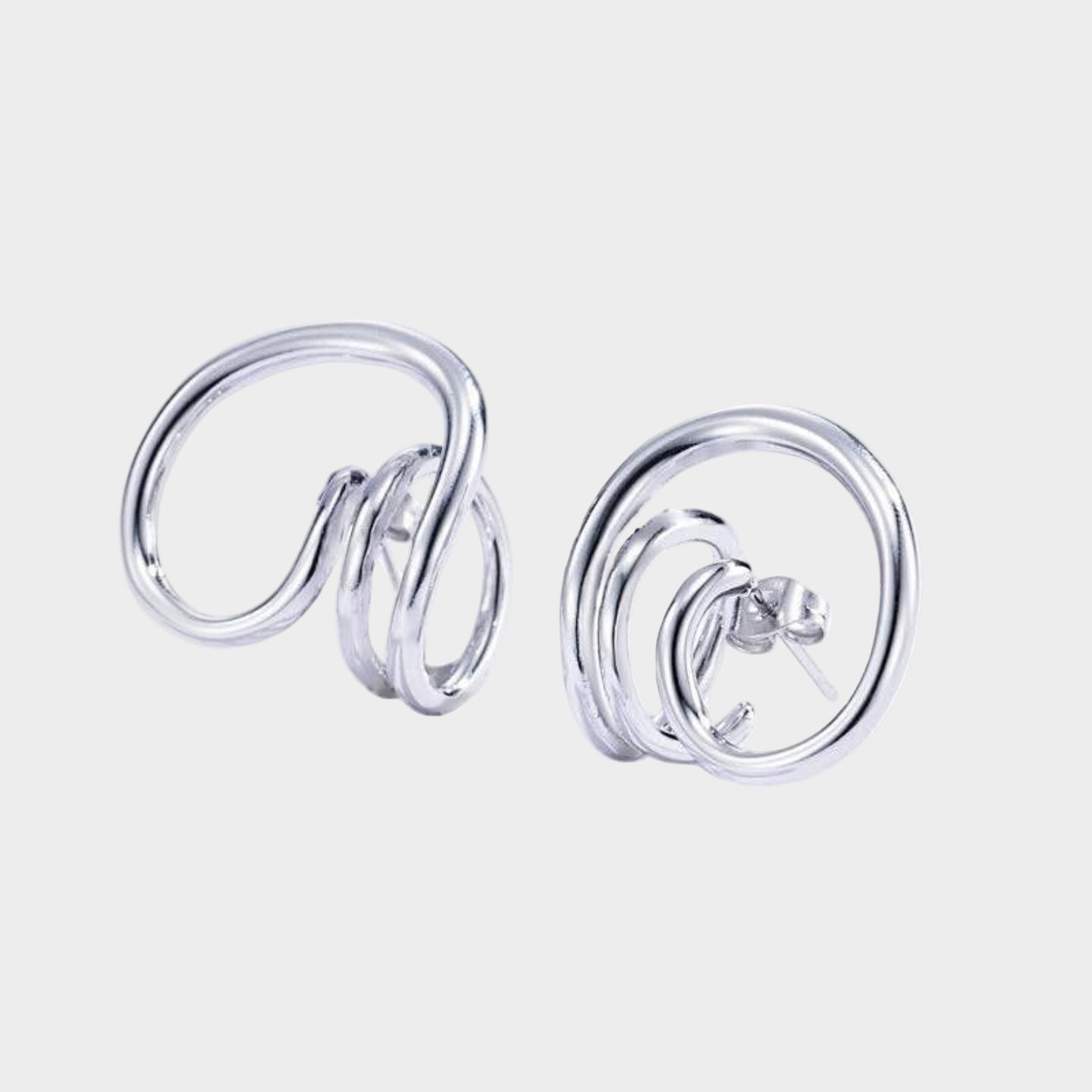 Silver spiral earrings on a white background