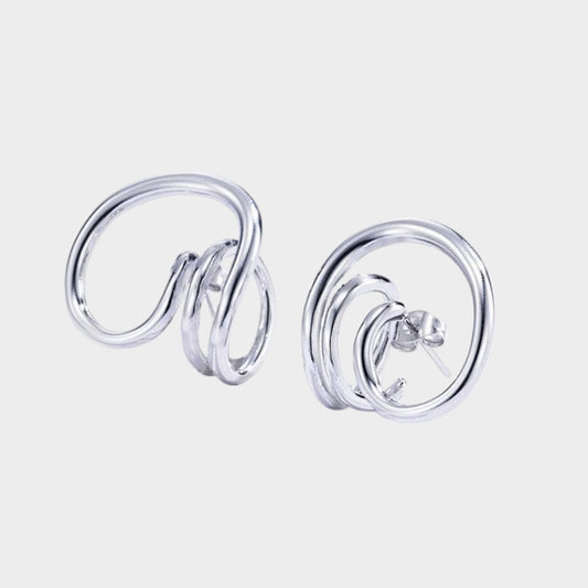 Silver spiral earrings on a white background